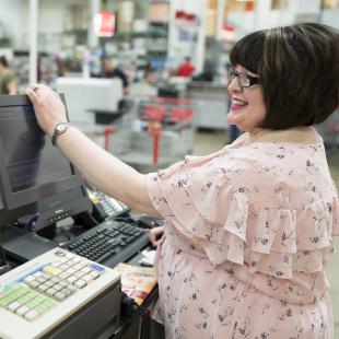 Warehouse employee at register